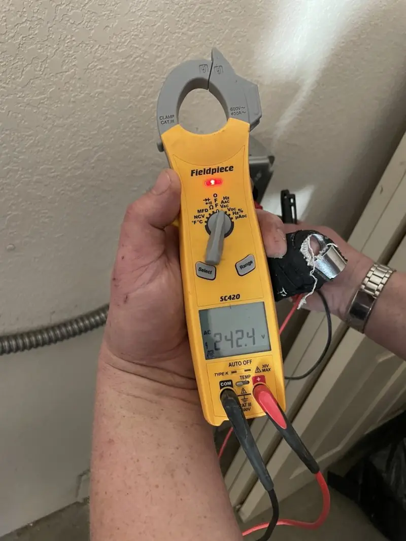 Voltage testing with clamp meter during Electrical Installation Services in Jaffrey